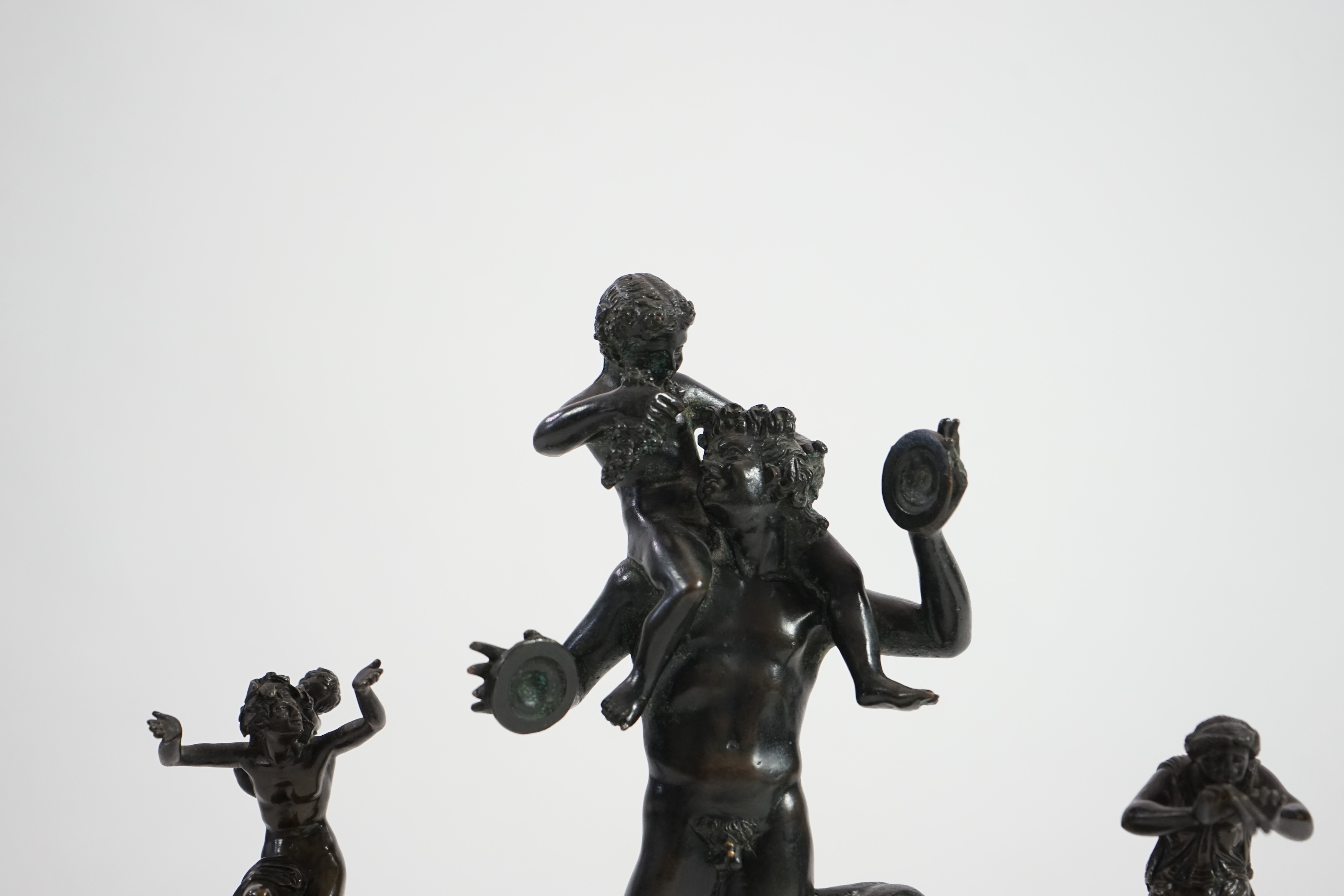 After the antique, three classical bronzes, faun with child Dionysius